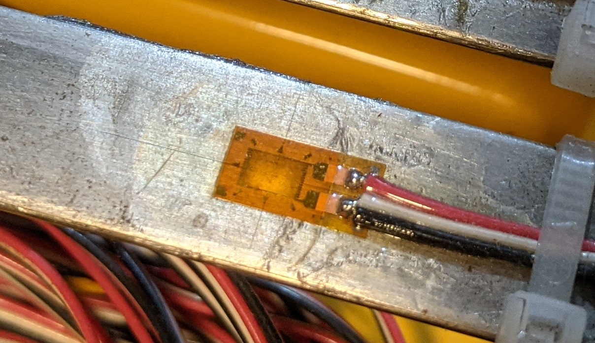 A strain gauge installed on a steel beam